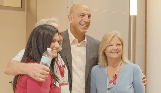 People hugging at the Patient Experience