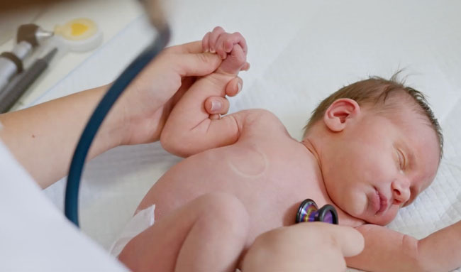 Baby Tested for Congenital Heart Valve Disease with Stethoscope