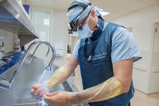 Dr. Andrei Churyla Scrubbing In For Heart Surgery