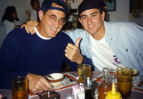 Jerry Pick with Adam Pick wearing hats backwards at a bar