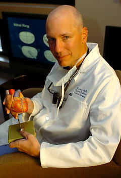 Doctor David Adams Holding A Heart