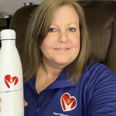 Deena wearing HVS swag and holding a water bottle