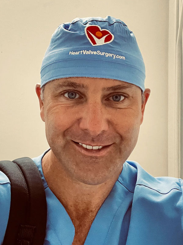 Dr. Allen Stewart wearing HeartValveSurgery.com scrub cap