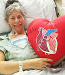 Heart Valve Patient Holding Big Red Pillow