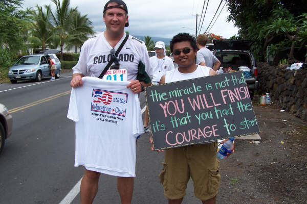 Jarrett Roberts holding marathon t-shirt