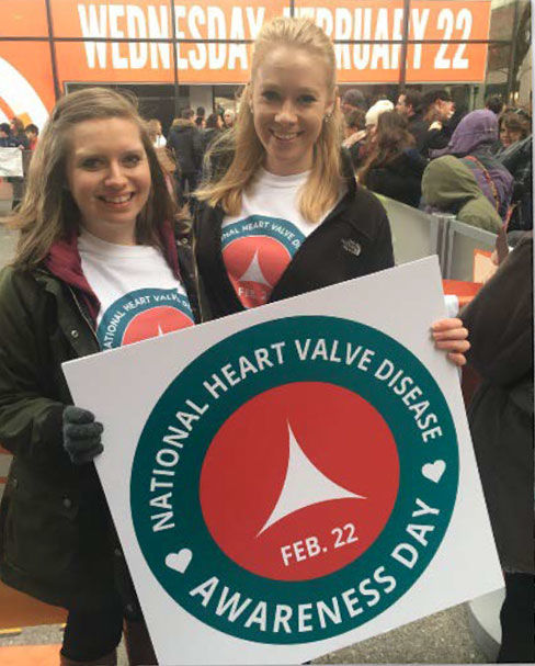 Women holding Valve Disease Day sign