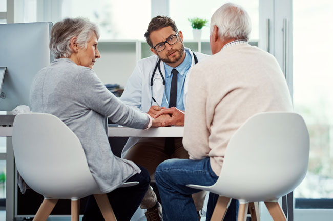 Heart surgery patient talking with doctor