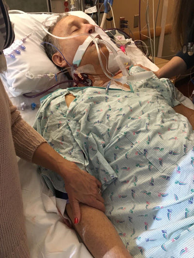 Phil in intensive care unit of hospital after heart valve surgery.
