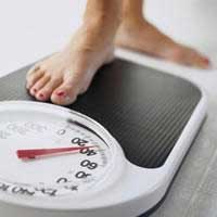 Foot stepping on weight scale