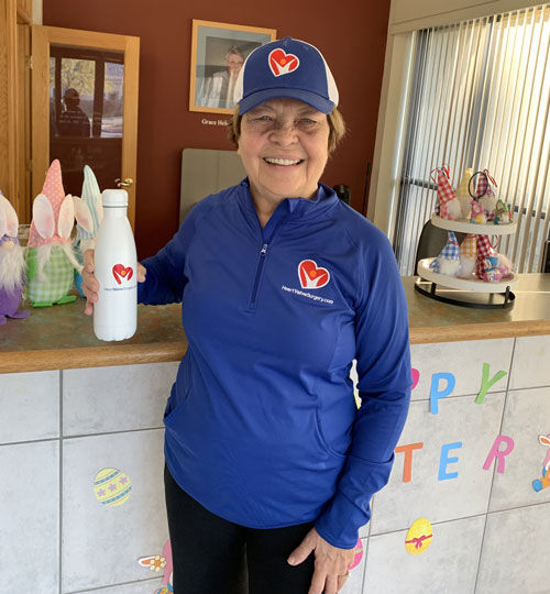 Patient Wearing HeartValveSurgery.com Hat, Pullover and Water Bottle