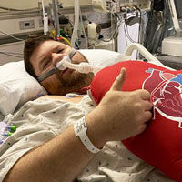 Patient with Red Pillow in Hospital