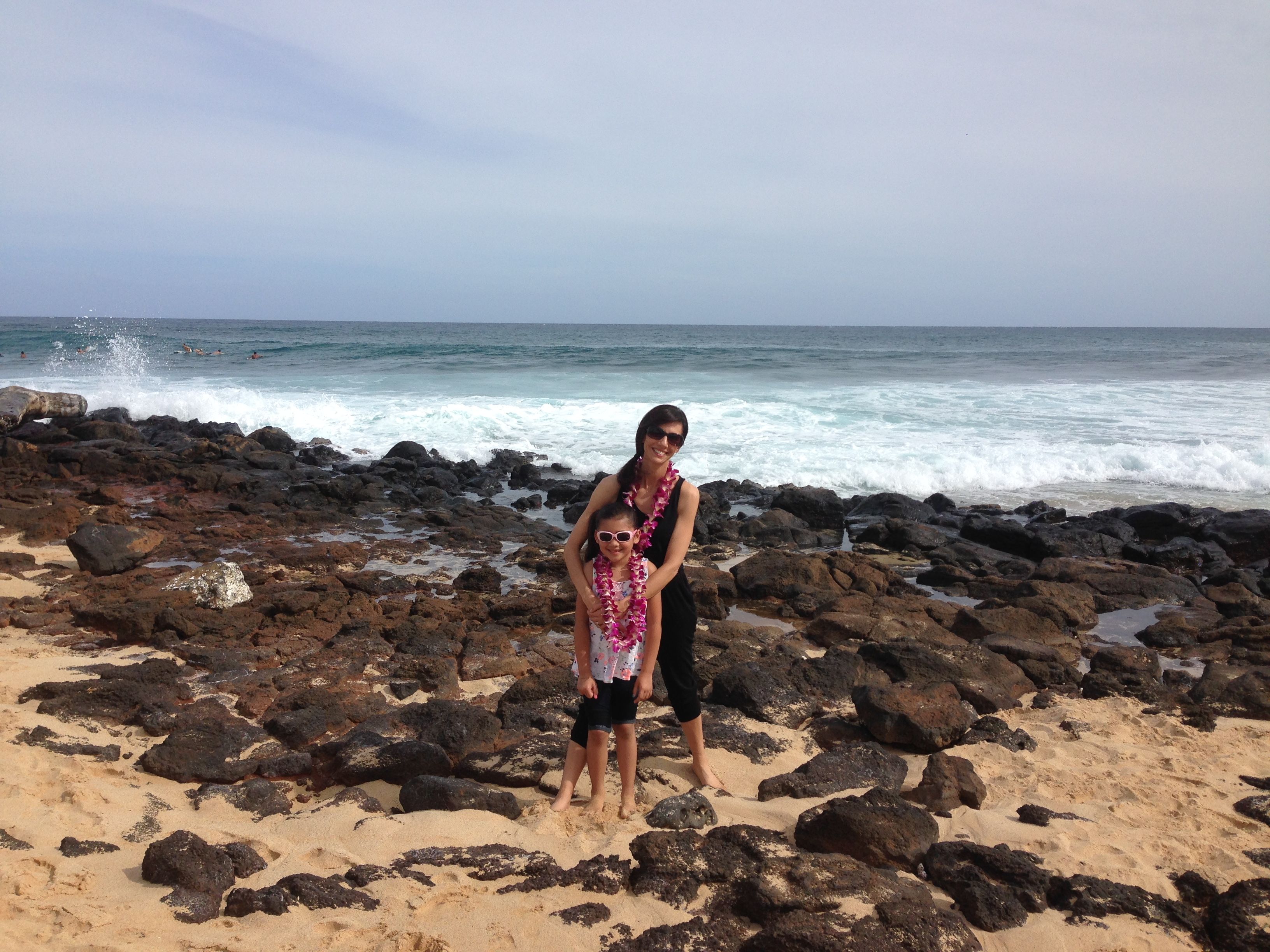 My granddaughter and I on the beach in Kauai.